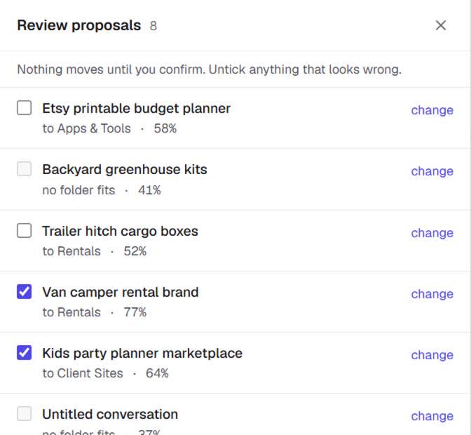 The review drawer: folder proposals with confidence percentages, checkboxes and a change control per row.
